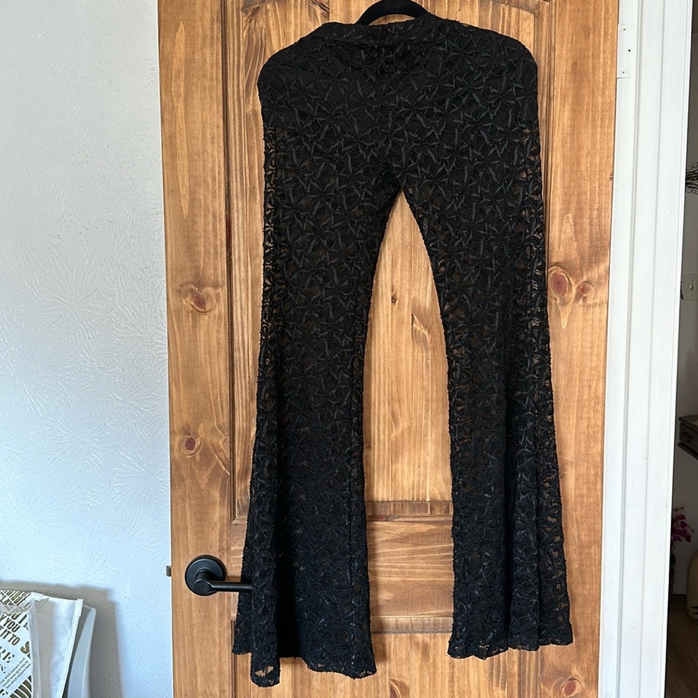 Beautiful black fitted and flared net see-through pants with shorts underneath